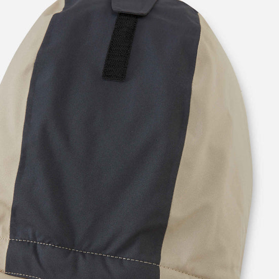 Tuta da neve Reima Skaulo ReimaTec per bambini, colore Earthy Beige – Dettaglio al ginocchio